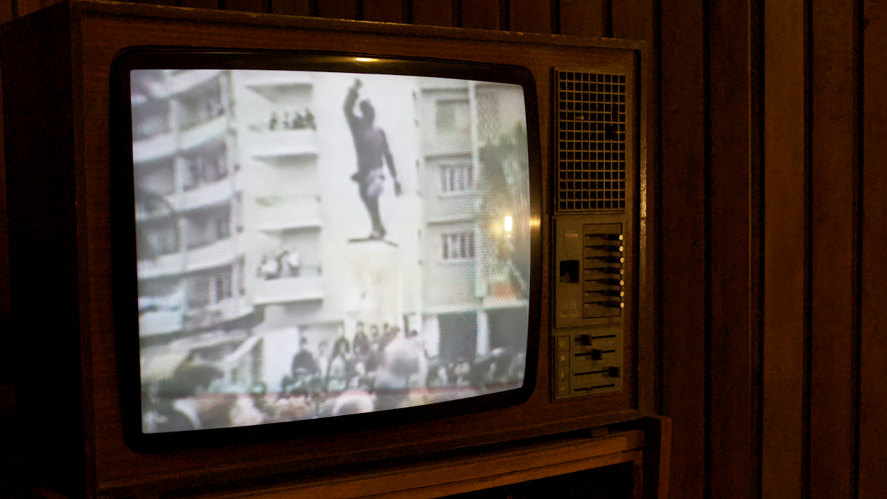 Vintage TV displaying a person on a building, set against a wooden panel wall in a dimly lit room.