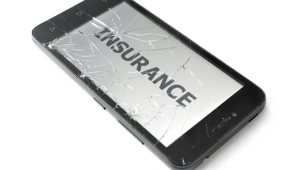 Cracked smartphone screen with "INSURANCE" text, symbolizing need for device protection coverage.